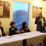 Judges Brian Platz, Janet Lindstrom, and Leslee Asch, with Tedrowe Bonner as MC.